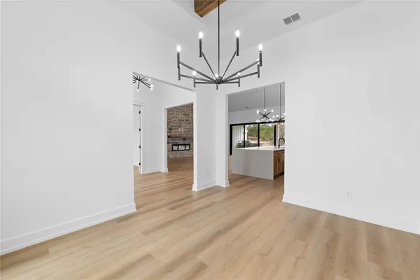 a view of a kitchen with a sink and a ceiling fan