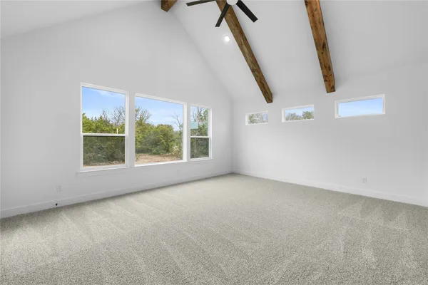 a view of empty room with windows