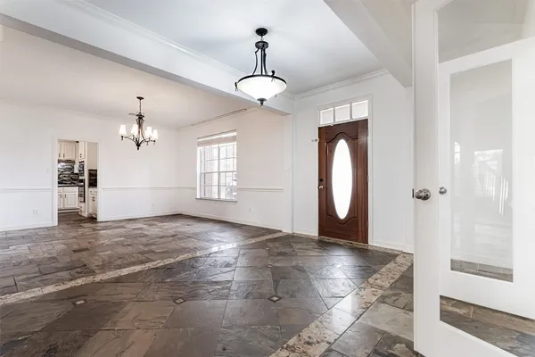 a large kitchen with stainless steel appliances kitchen island granite countertop a refrigerator and a stove top oven