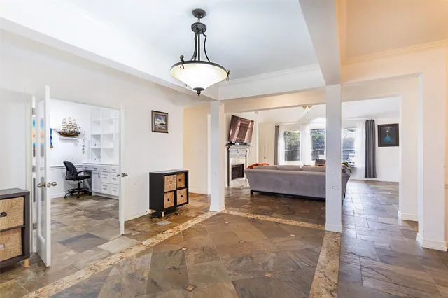 a view of a livingroom with furniture and a chandelier