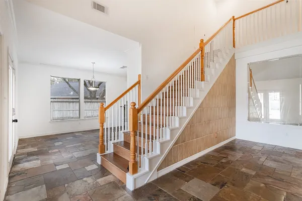 a kitchen with a sink and a stove top oven