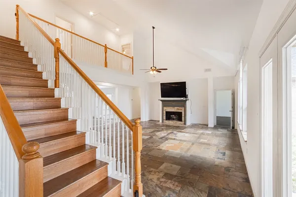 a kitchen with granite countertop a stove and a microwave