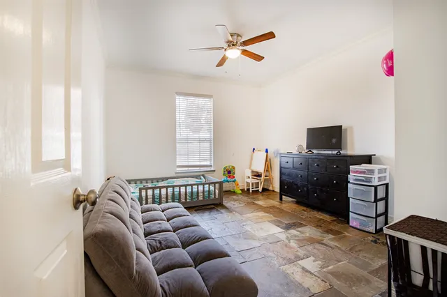 a bedroom with furniture and a window