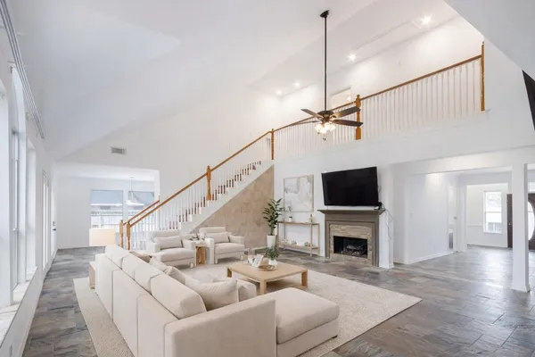a work room with furniture and a bookshelf