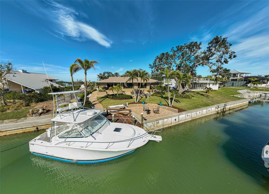 641 Bayshore Road Nokomis, FL 34275 - Photo 24 of 63 a view of a table and chairs in the patio