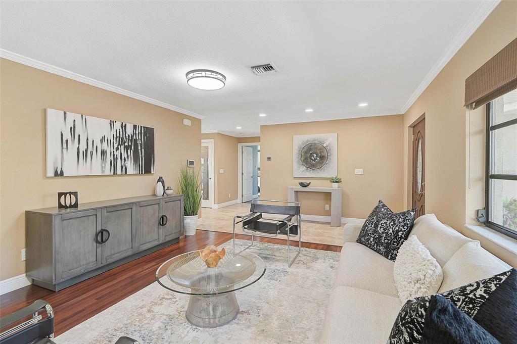 641 Bayshore Road Nokomis, FL 34275 - Photo 27 of 63 a living room with furniture and a table