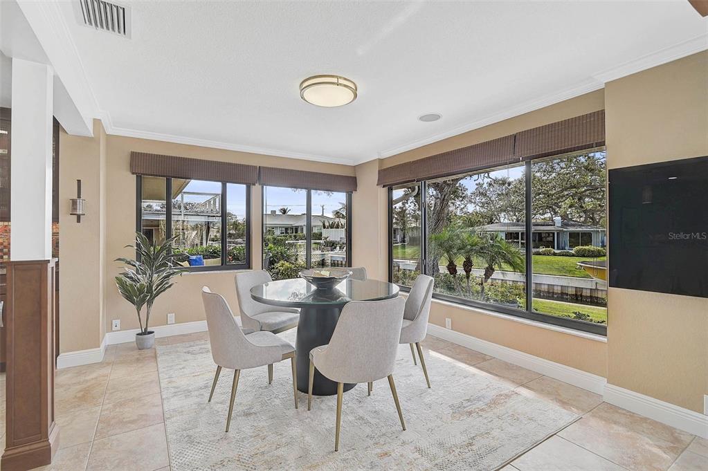641 Bayshore Road Nokomis, FL 34275 - Photo 34 of 63 a dining room with furniture and a large window