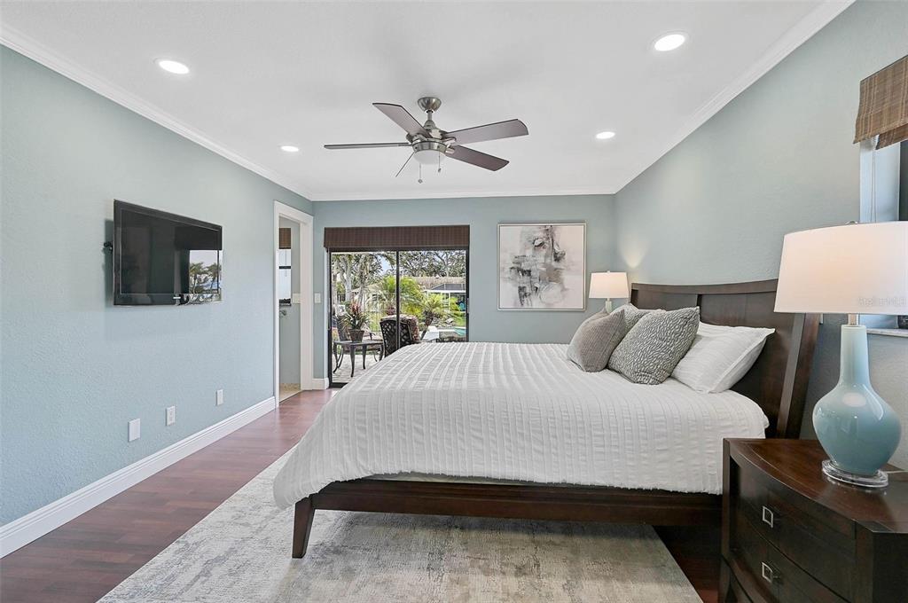 641 Bayshore Road Nokomis, FL 34275 - Photo 38 of 63 a bedroom with a large bed and a flat screen tv