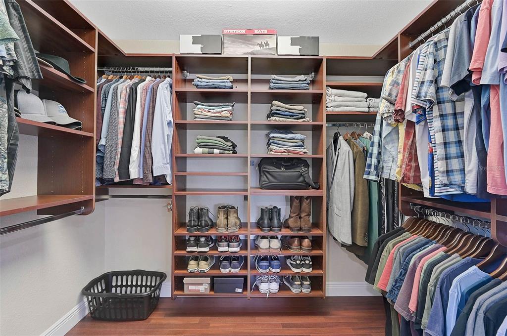 641 Bayshore Road Nokomis, FL 34275 - Photo 40 of 63 a view of walk in closet with clothes and shoes