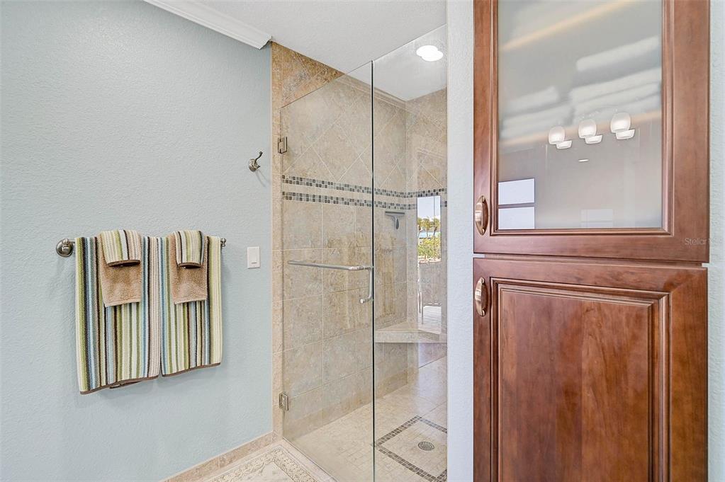 641 Bayshore Road Nokomis, FL 34275 - Photo 42 of 63 a bathroom with a mirror and a shower