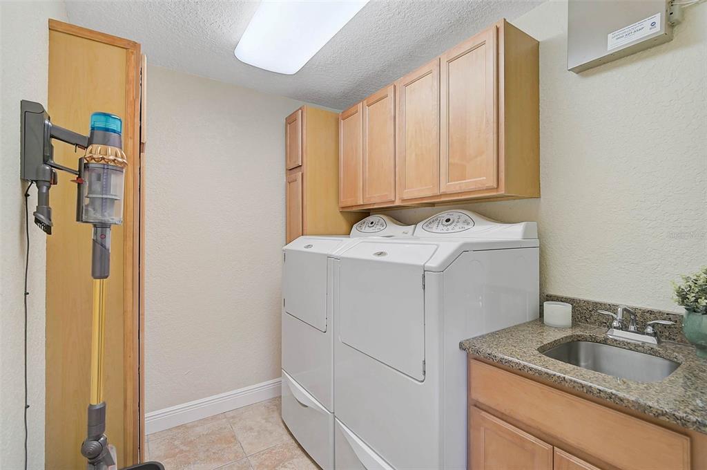 641 Bayshore Road Nokomis, FL 34275 - Photo 47 of 63 a utility room with dryer and washer