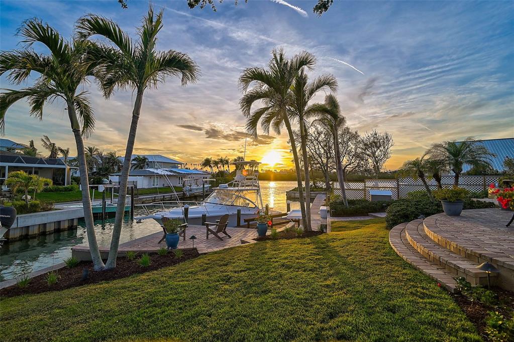 641 Bayshore Road Nokomis, FL 34275 - Photo 50 of 63 a row of palm trees sitting in a yard with swimming pool