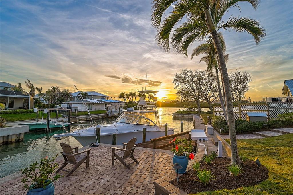 641 Bayshore Road Nokomis, FL 34275 - Photo 51 of 63 a view of a lake with a table and chairs