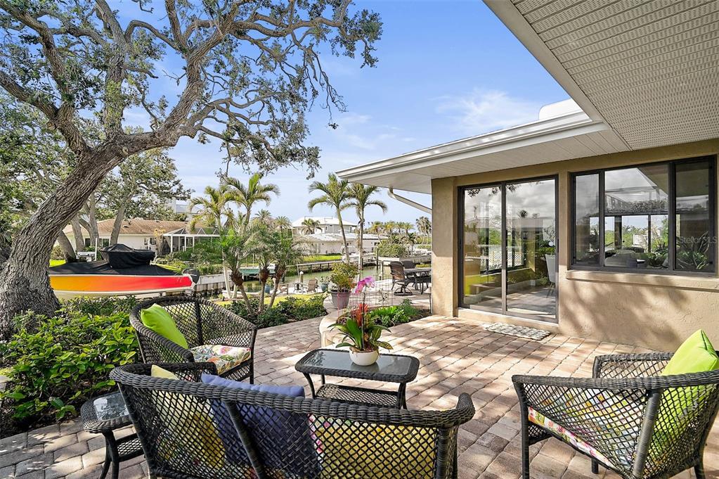 641 Bayshore Road Nokomis, FL 34275 - Photo 56 of 63 a outdoor living space with patio furniture and a potted plant