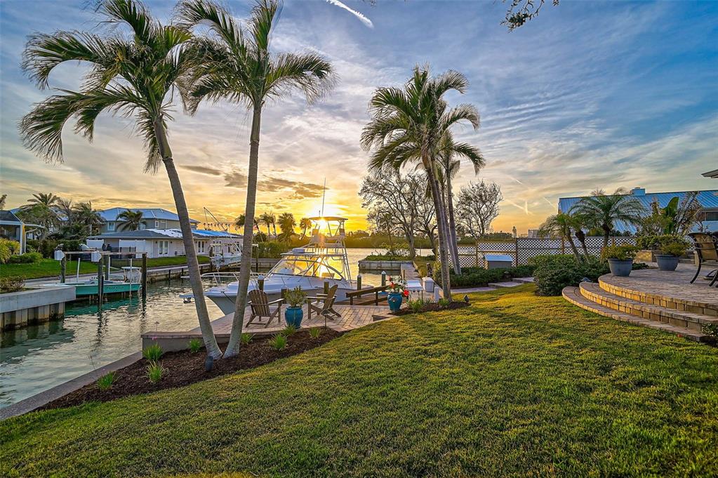 641 Bayshore Road Nokomis, FL 34275 - Photo 58 of 63 a row of palm trees sitting in a yard with swimming pool