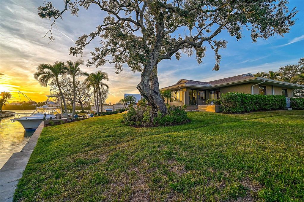 641 Bayshore Road Nokomis, FL 34275 - Photo 60 of 63 a front view of a house with garden