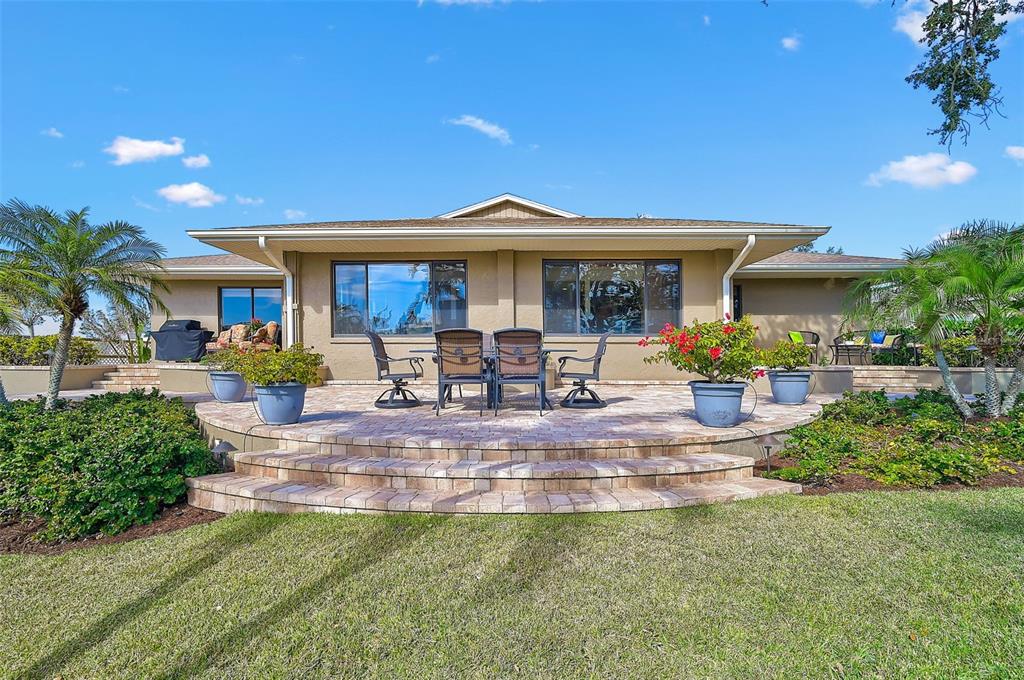 641 Bayshore Road Nokomis, FL 34275 - Photo 8 of 63 a view of a house with swimming pool and sitting area