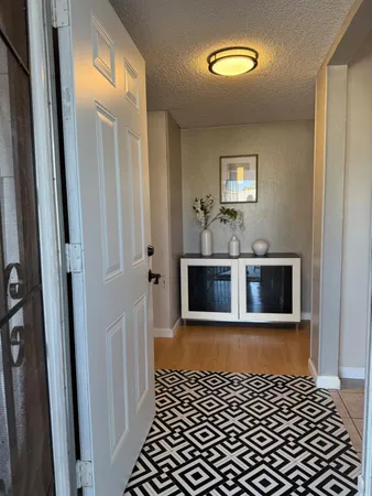 a view of a hallway view with staircase