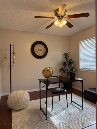 a view of a livingroom with furniture and a chandelier