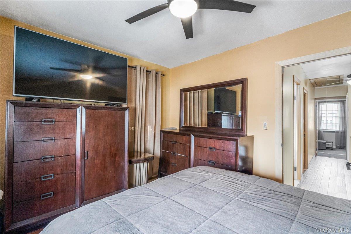 14428 158th Street Queens, NY 11434 - Photo 11 of 17 a bedroom with a bed and a flat screen tv