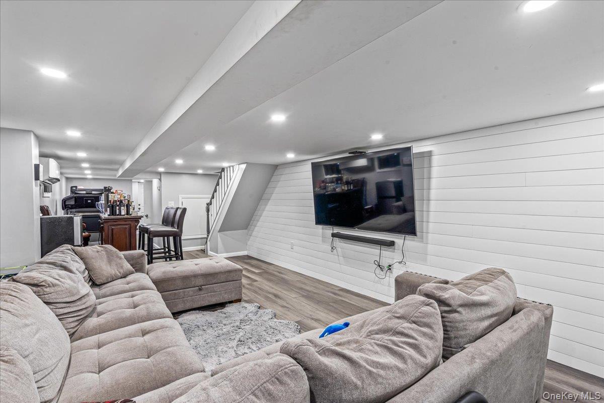 14428 158th Street Queens, NY 11434 - Photo 14 of 17 a living room with furniture and a flat screen tv