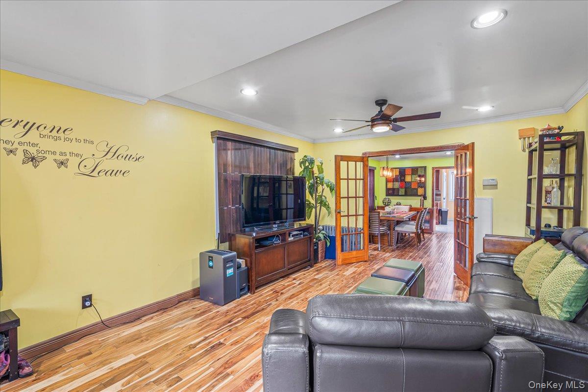 14428 158th Street Queens, NY 11434 - Photo 2 of 17 a living room with furniture and a flat screen tv