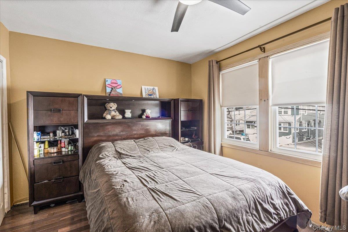 14428 158th Street Queens, NY 11434 - Photo 10 of 17 a bedroom with a bed and a large window with the outer view