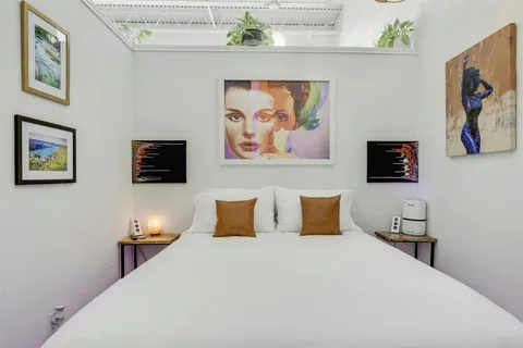a view of a workspace with furniture and a potted plant