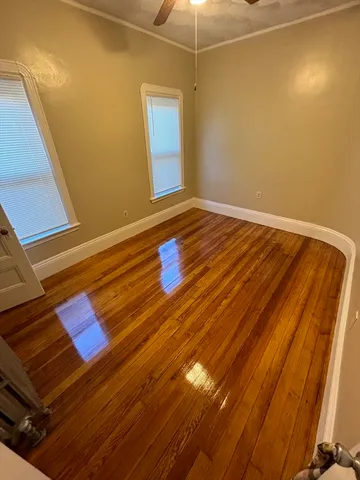 a view of room with wooden floor