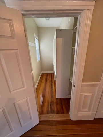 a view of an entryway with wooden floor