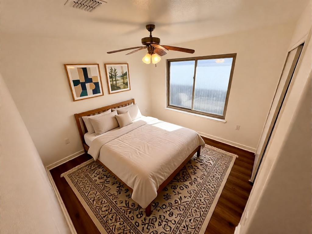8003 Bannock Lane Austin, TX 78747 - Photo 24 of 40 This room features hardwood flooring, a ceiling fan, and a window providing natural light