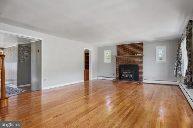 a kitchen with stainless steel appliances granite countertop a refrigerator and a stove