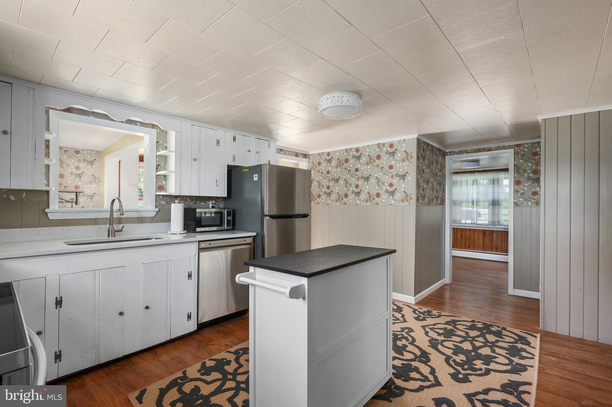 16357 Trenton Road Upperco, MD 21155 - Photo 21 of 68 a kitchen with refrigerator and cabinets