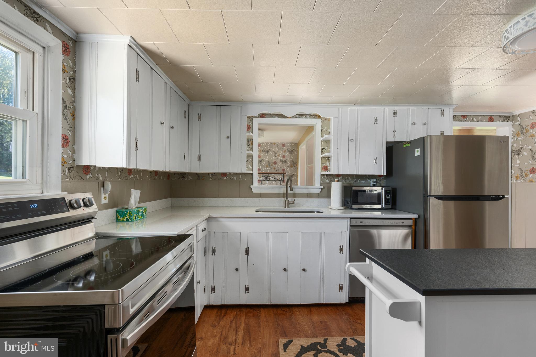 16357 Trenton Road Upperco, MD 21155 - Photo 22 of 68 a kitchen with a refrigerator sink and stove