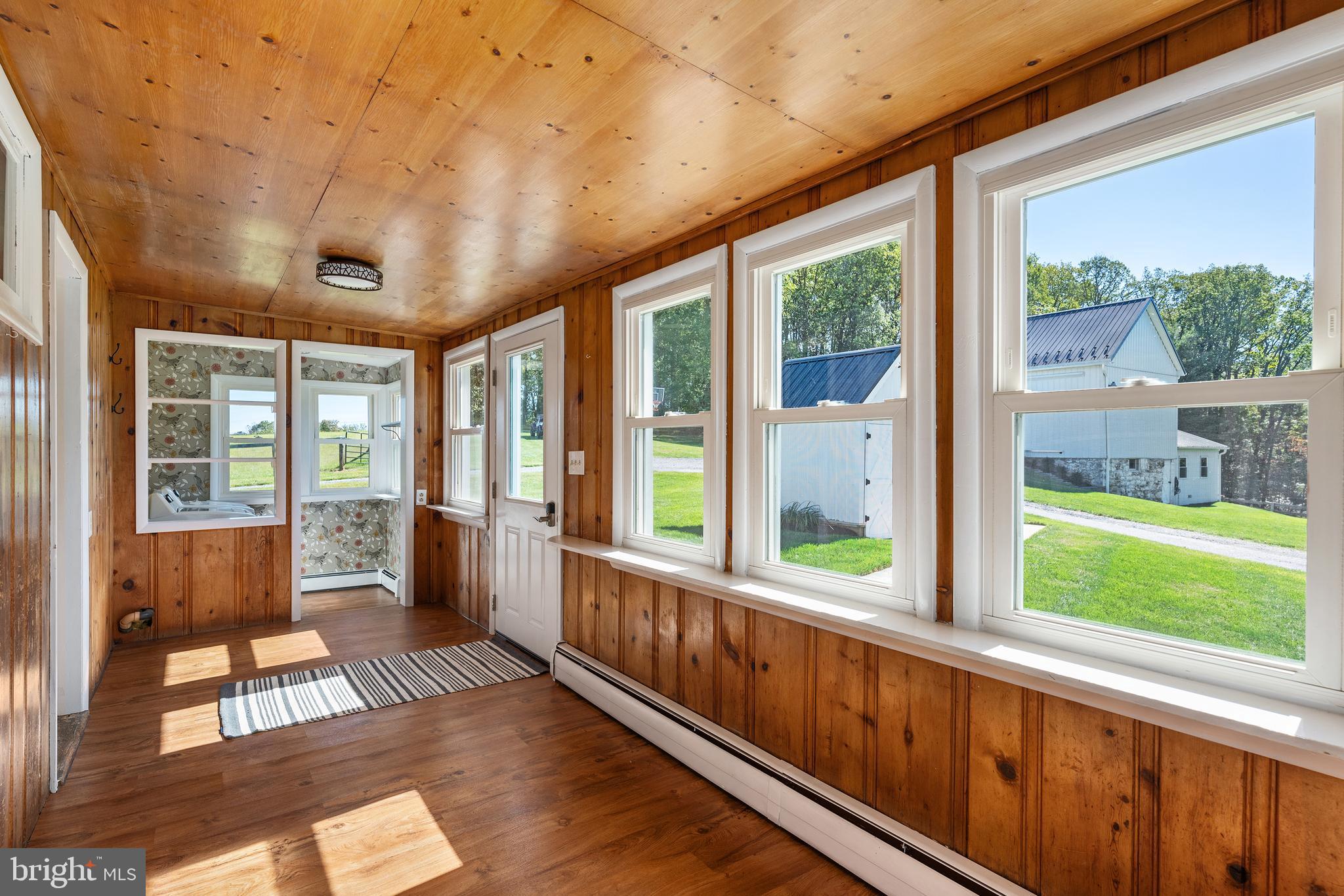 16357 Trenton Road Upperco, MD 21155 - Photo 28 of 68 a view of a porch with wooden floor and outdoor space