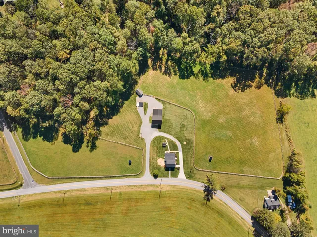 a aerial view of a house with a yard