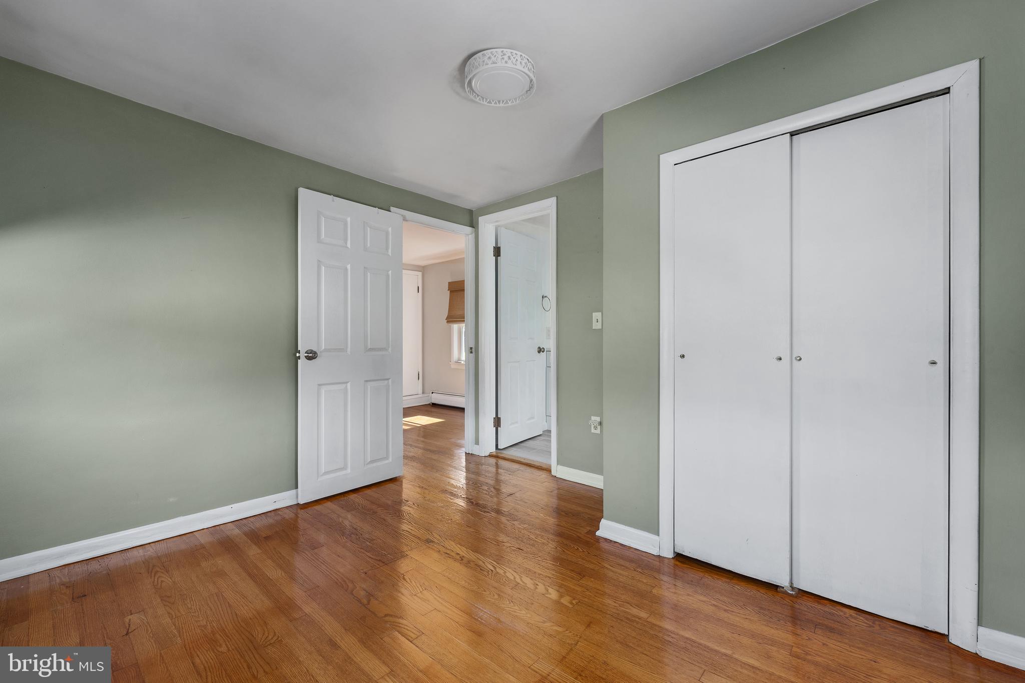 16357 Trenton Road Upperco, MD 21155 - Photo 36 of 68 a view of an empty room with wooden floor and a window