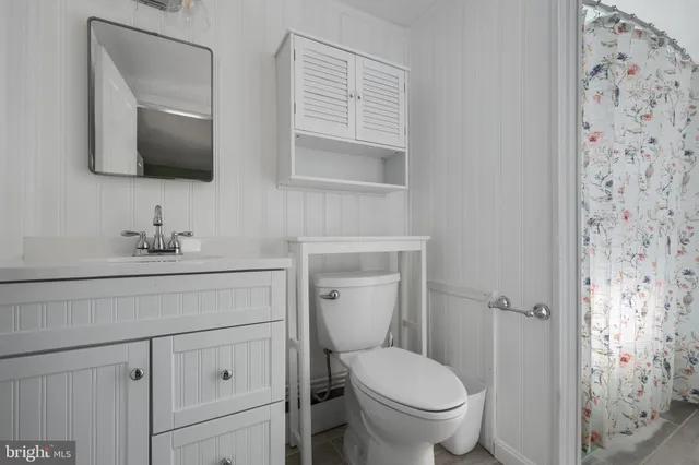 a view of a room with wooden walls