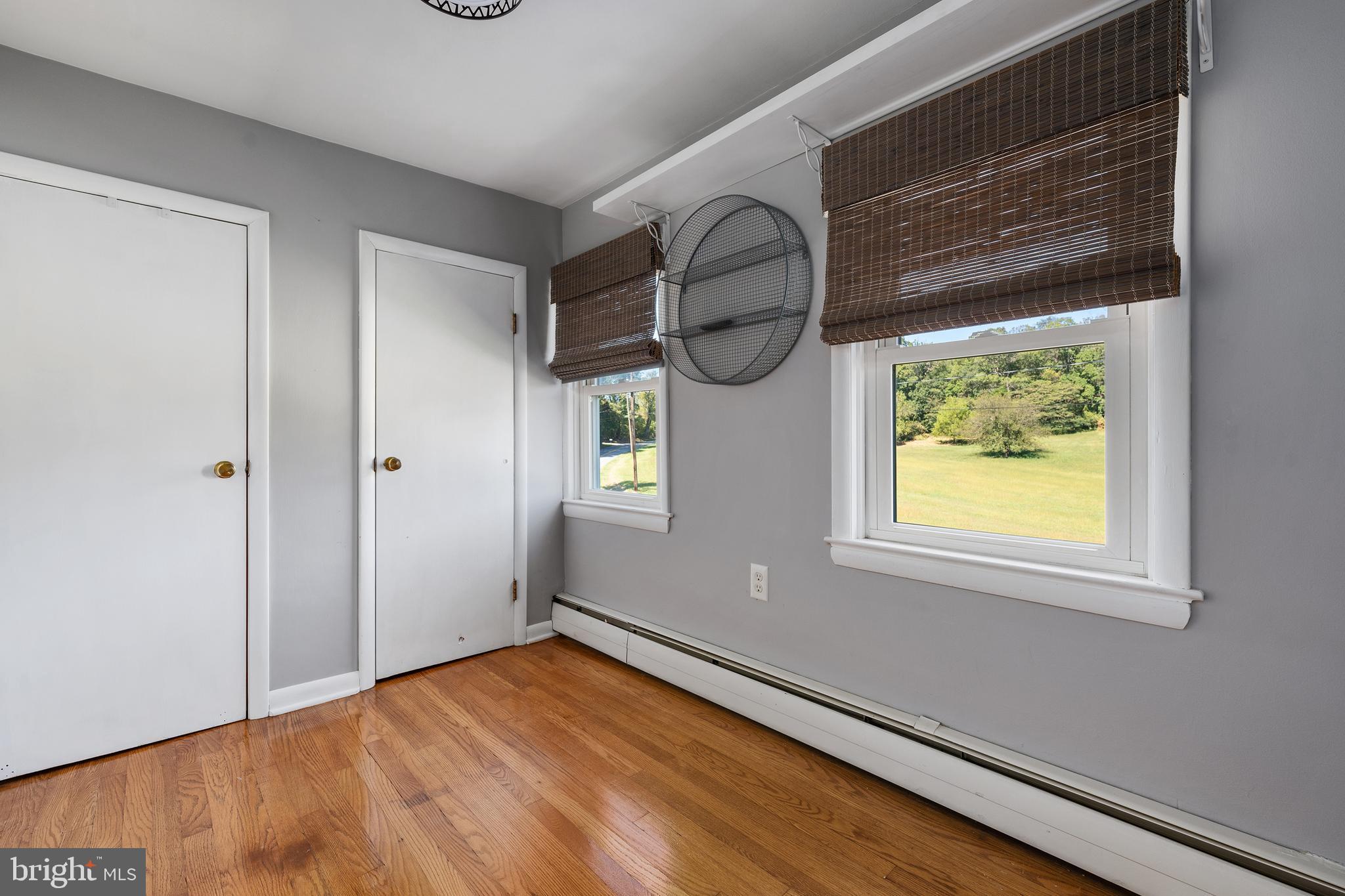 16357 Trenton Road Upperco, MD 21155 - Photo 40 of 68 a view of empty room with window and wooden floor