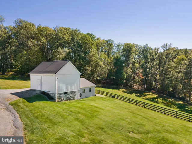 a view of a swimming pool with a yard