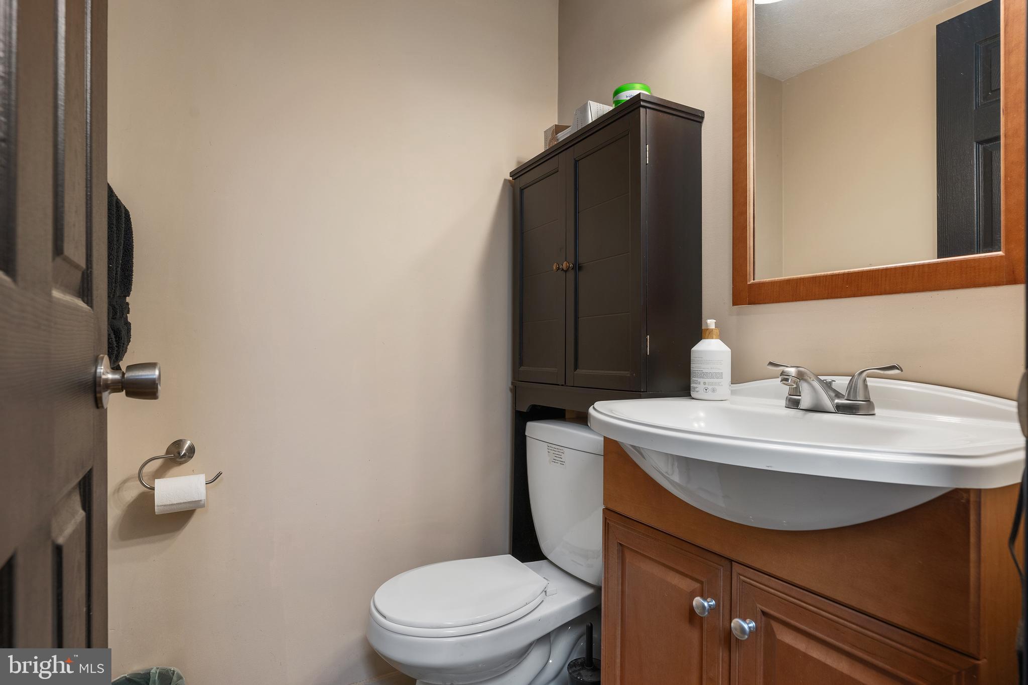 16357 Trenton Road Upperco, MD 21155 - Photo 50 of 68 a bathroom with a sink vanity mirror and toilet
