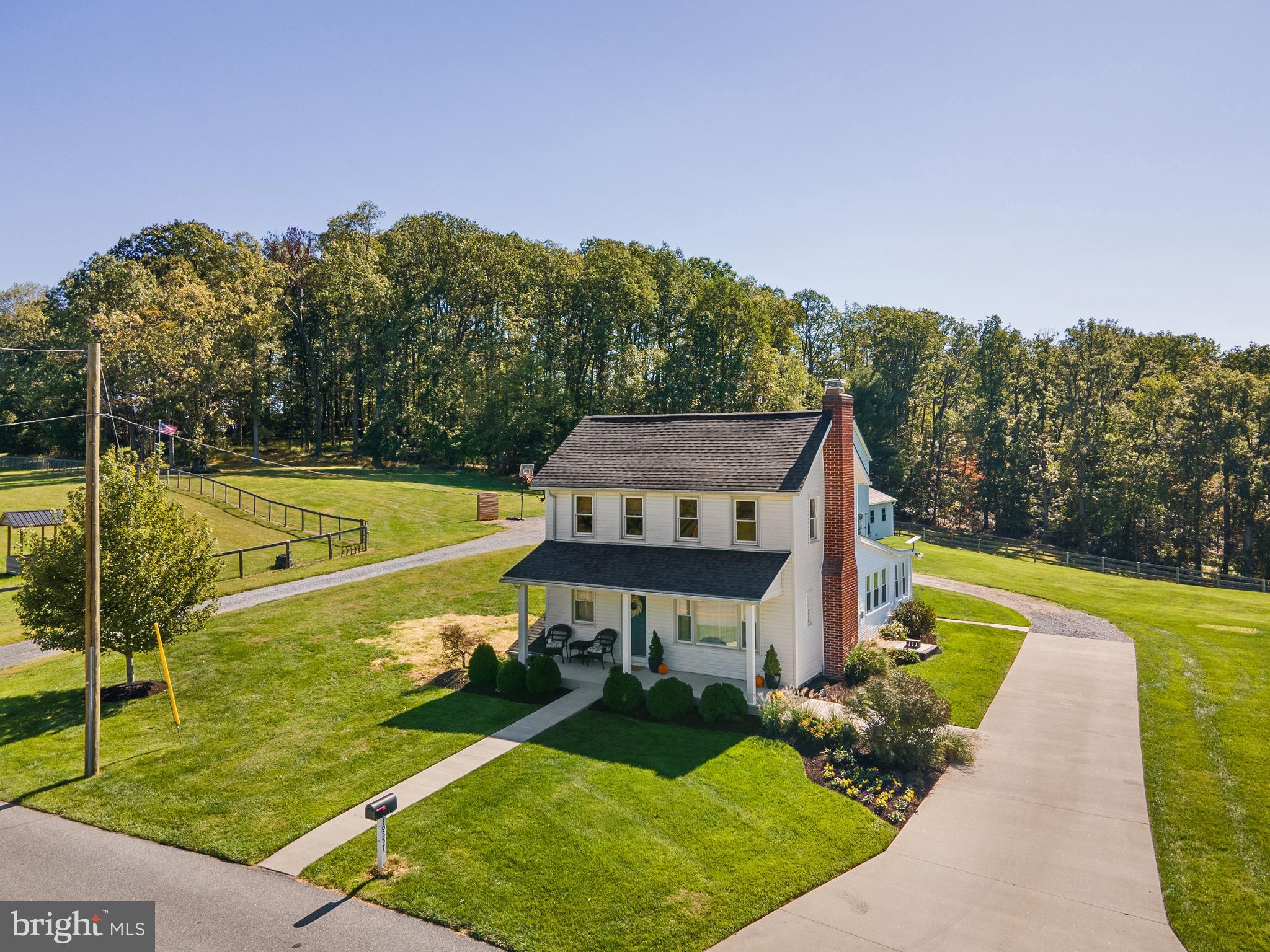 16357 Trenton Road Upperco, MD 21155 - Photo 10 of 68 a view of a swimming pool with a garden and trees