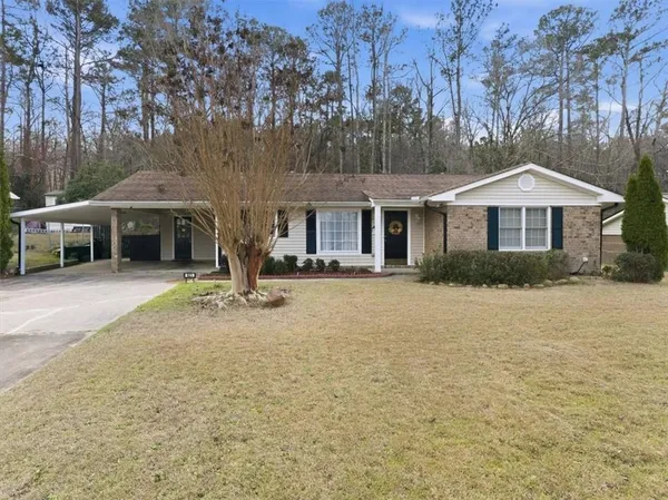 a front view of a house with garden