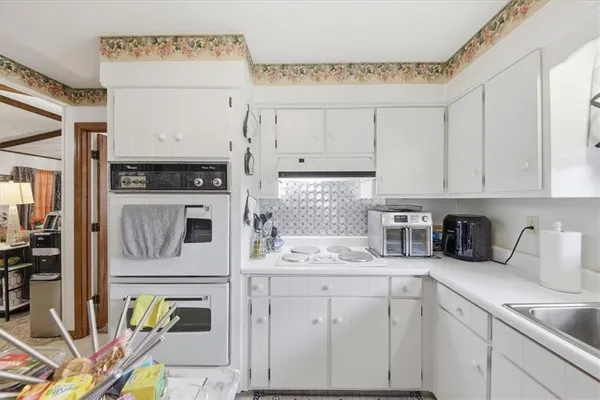 a kitchen with cabinets and appliances