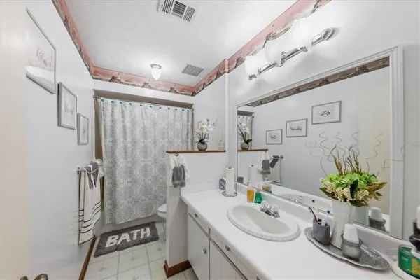 a bedroom with a bed and furniture