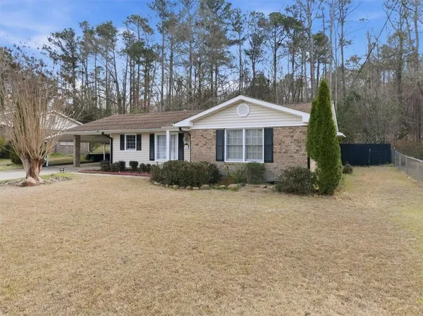 front view of a house with a yard