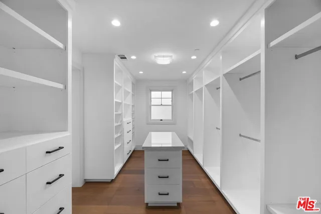 a view of entryway with hallway and wooden floor