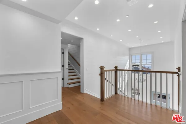 a view of staircase with wooden floor and stairs