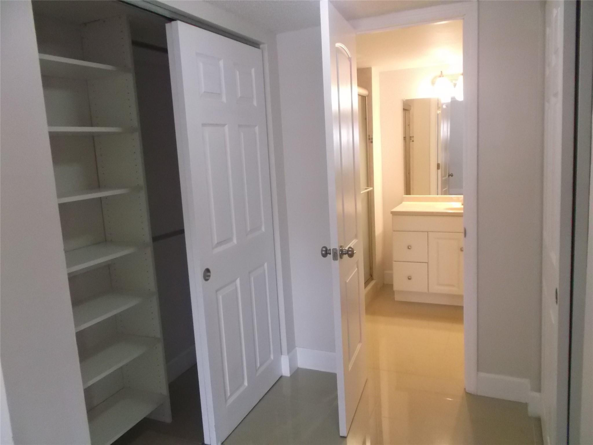 2955 Riverside Drive, Unit 103 Coral Springs, FL 33065 - Photo 15 of 26 a view of a bathroom with a tub and shower