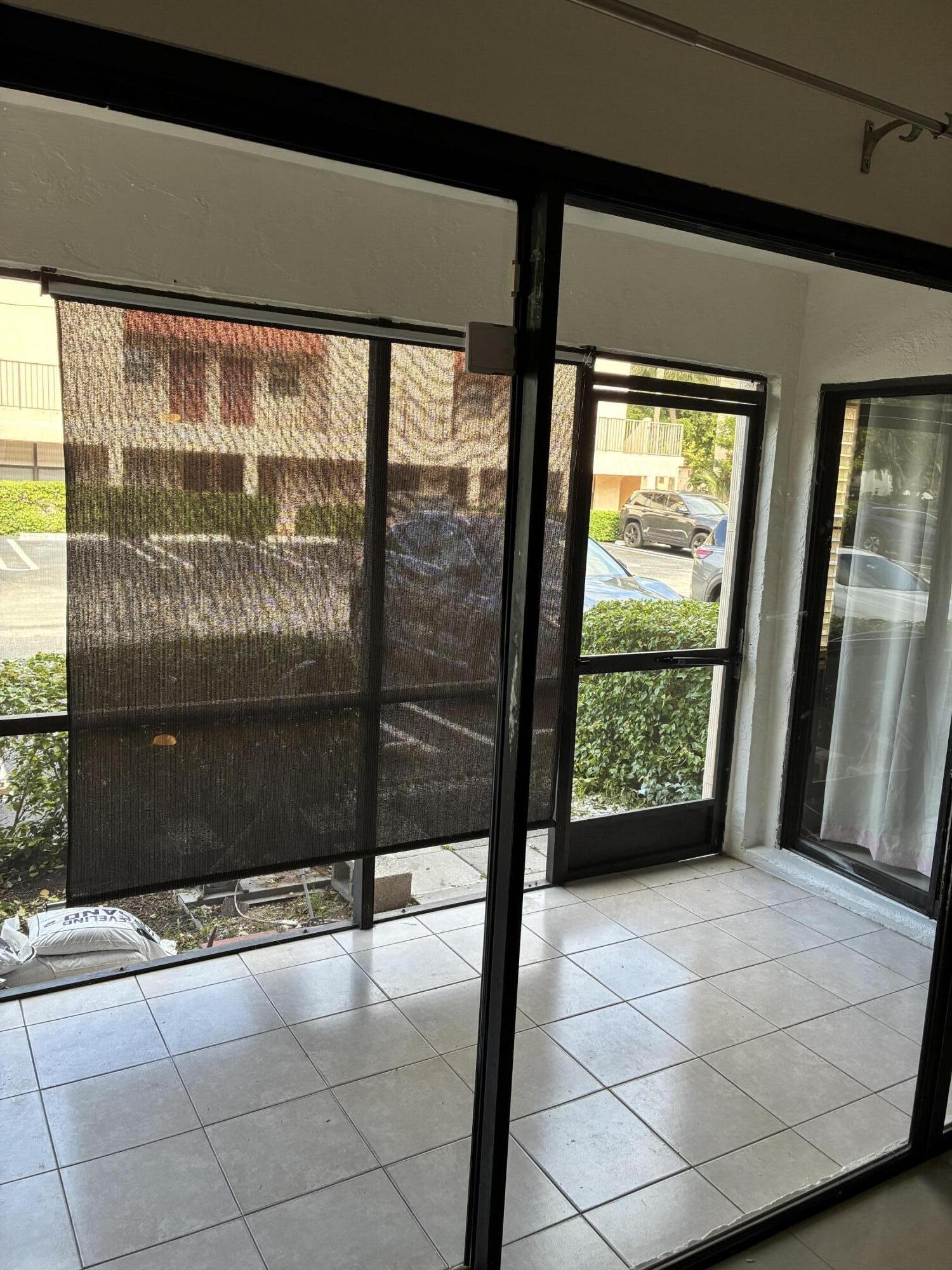 2955 Riverside Drive, Unit 103 Coral Springs, FL 33065 - Photo 21 of 26 a view of an empty room with a window